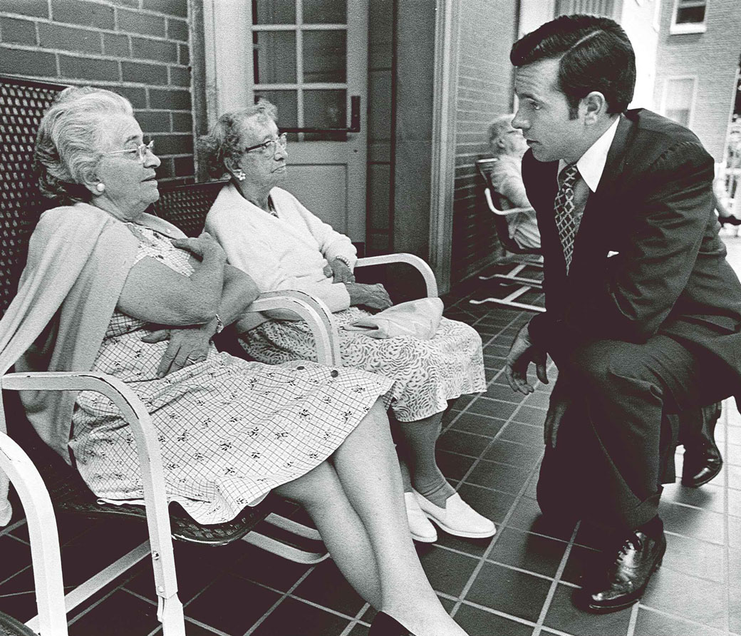 John Heinz speaking with elderly ladies